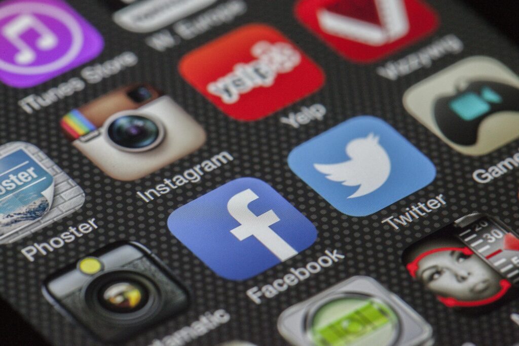 Close-up image of various social media app icons on a smartphone screen. digital marketing tips for Beginners